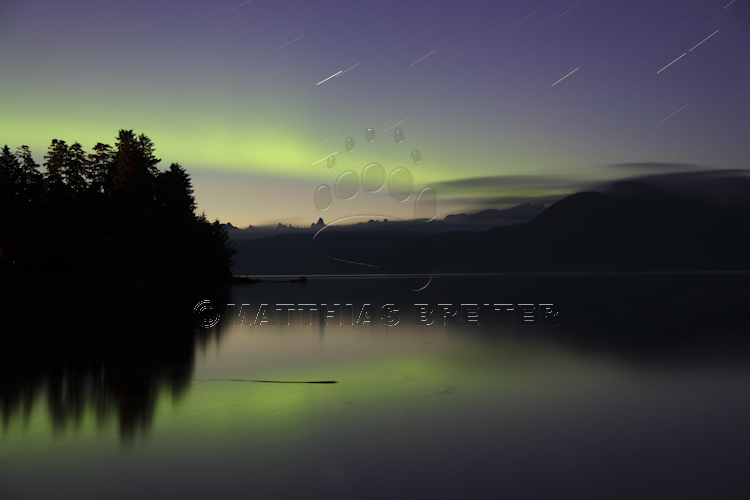 Northern Lights in Alaska reflecting on lake